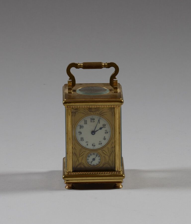 Null Brass travel alarm clock with glass sides, removable handle.

Early 20th ce&hellip;