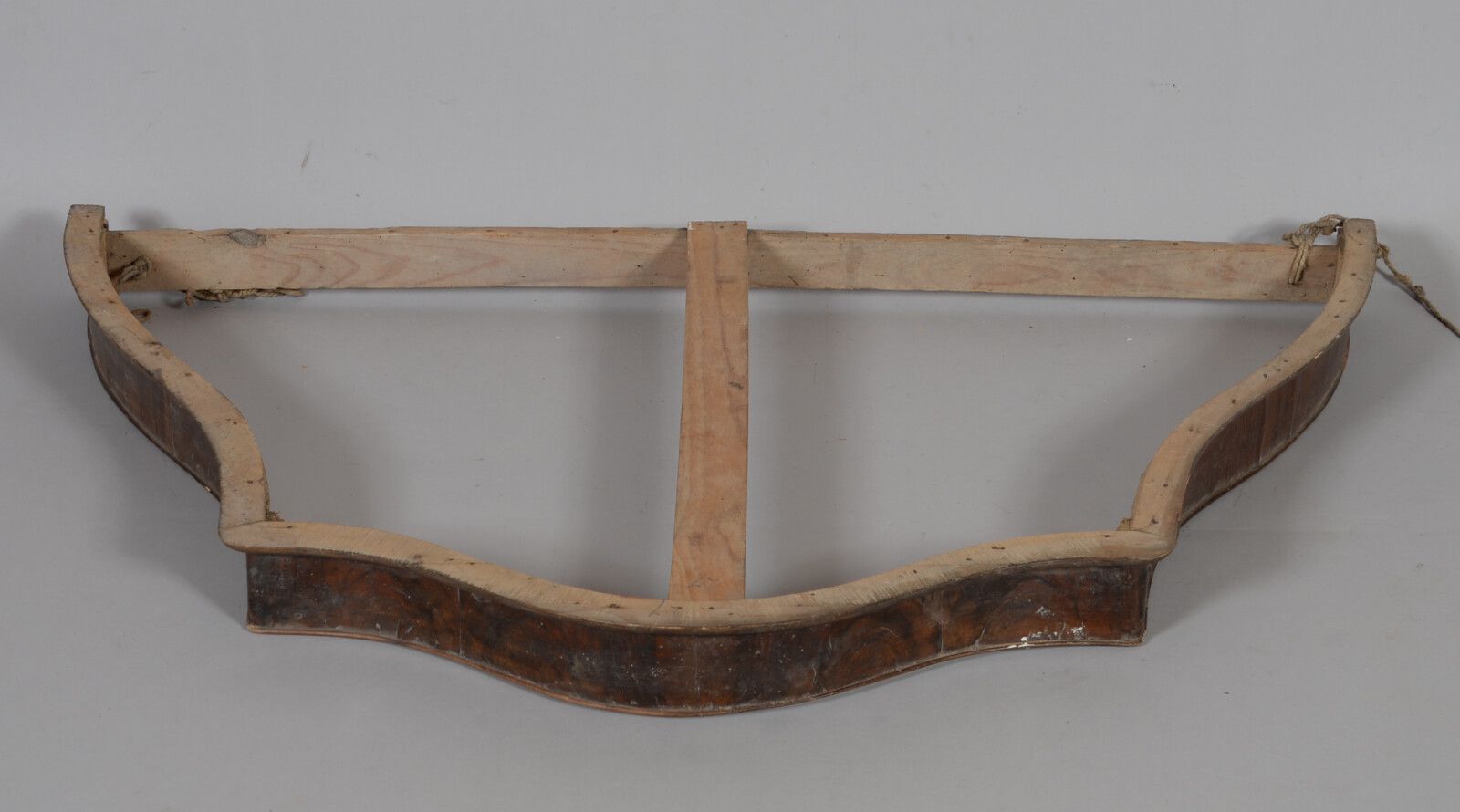 Null Walnut veneer bed frame.

Late 19th century

Height 75 cm Width 121 cm