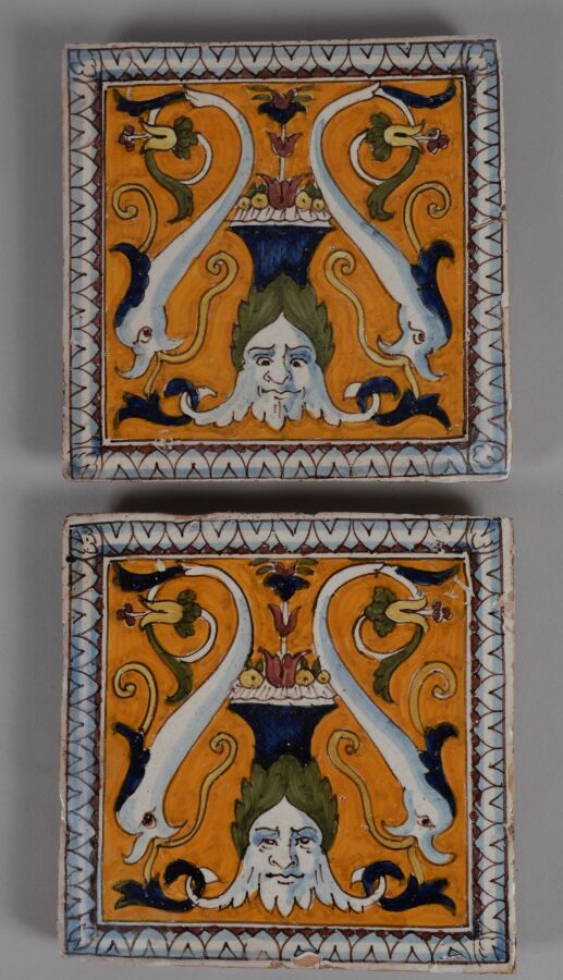 Null Deux carreaux en terre cuite à décor émaillé polychrome de rinceaux et masc&hellip;