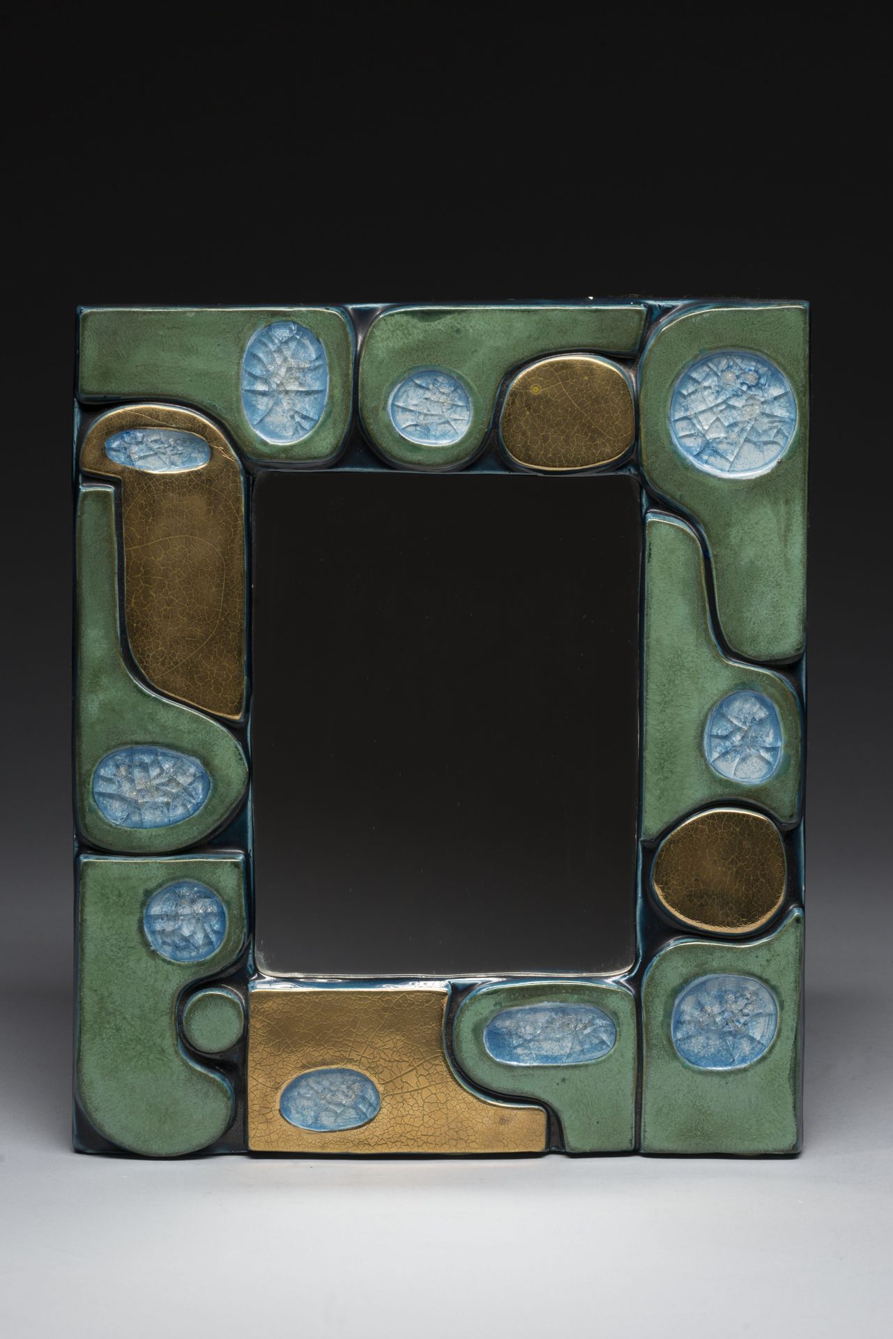 Null Mithé ESPELT (1923-2020). 
Mirror "Ouvéa" in green enamelled ceramic, crack&hellip;