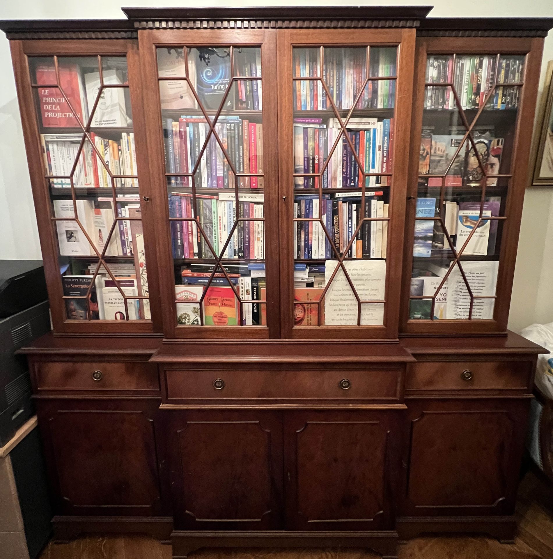 Null Mahogany veneered bookcase with central recess opening to four glass doors &hellip;