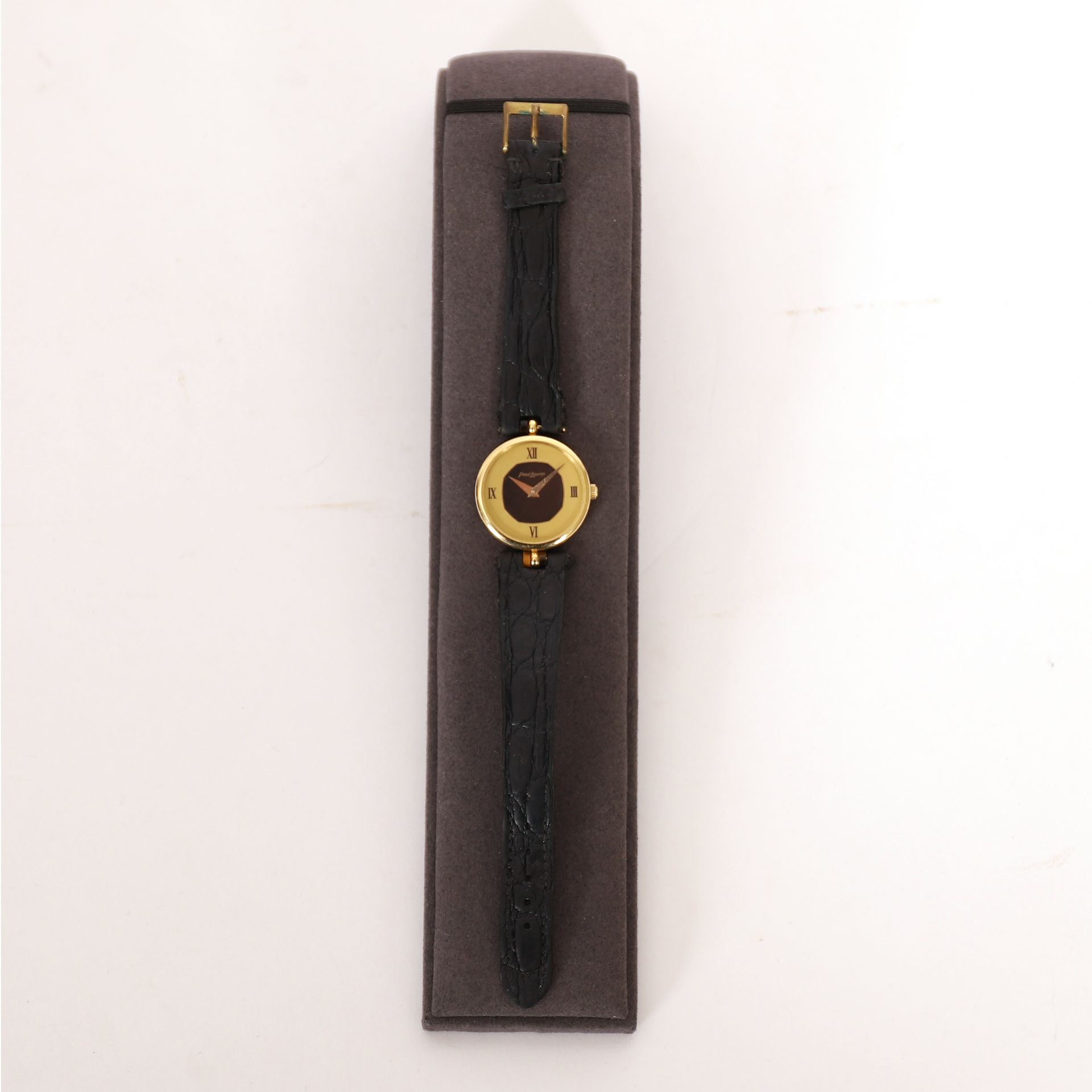 Null GOLDFARBENE UHR PAUL LAURIN

Armband aus schwarzem Leder

Pb: 22 grs