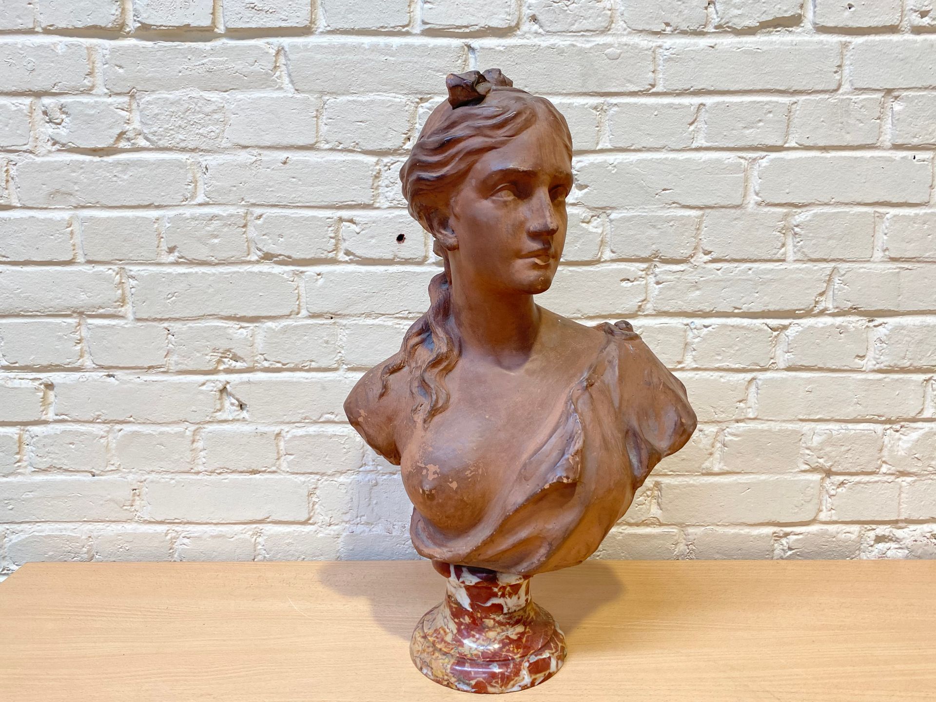 Null TERRACOTTA BUST WITH PATINA REPRESENTING A WOMAN WITH A BARE RIGHT BREAST

&hellip;