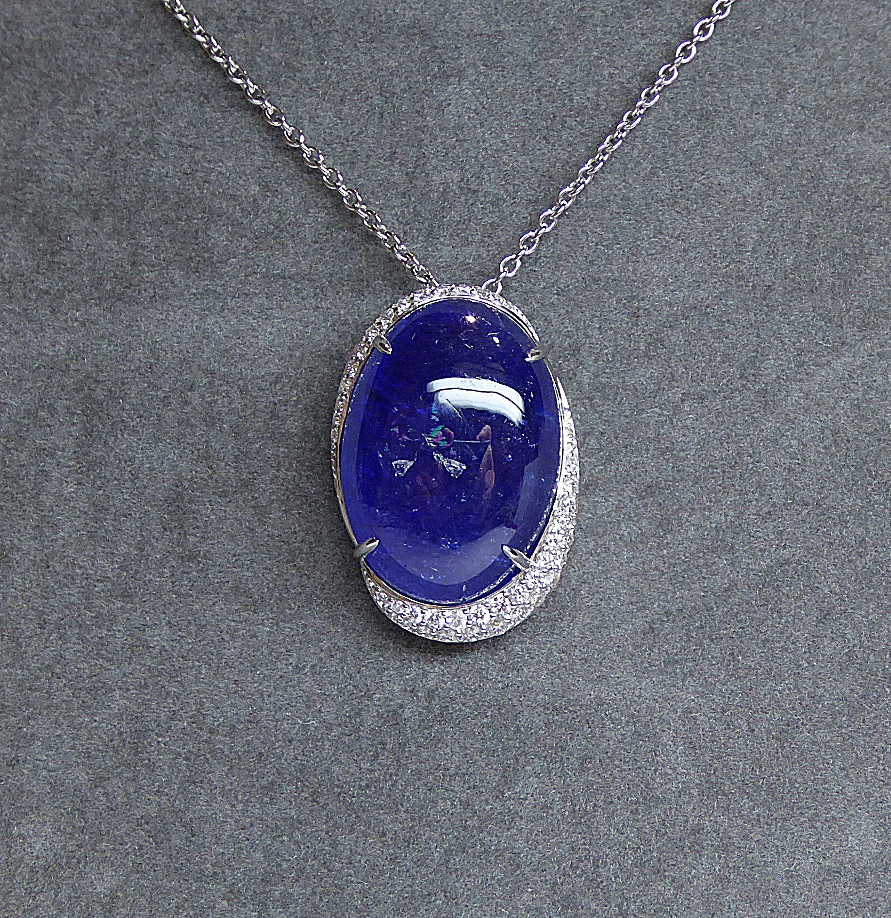 Null White gold pendant holding a large oval cabochon tanzanite weighing 25.92 c&hellip;