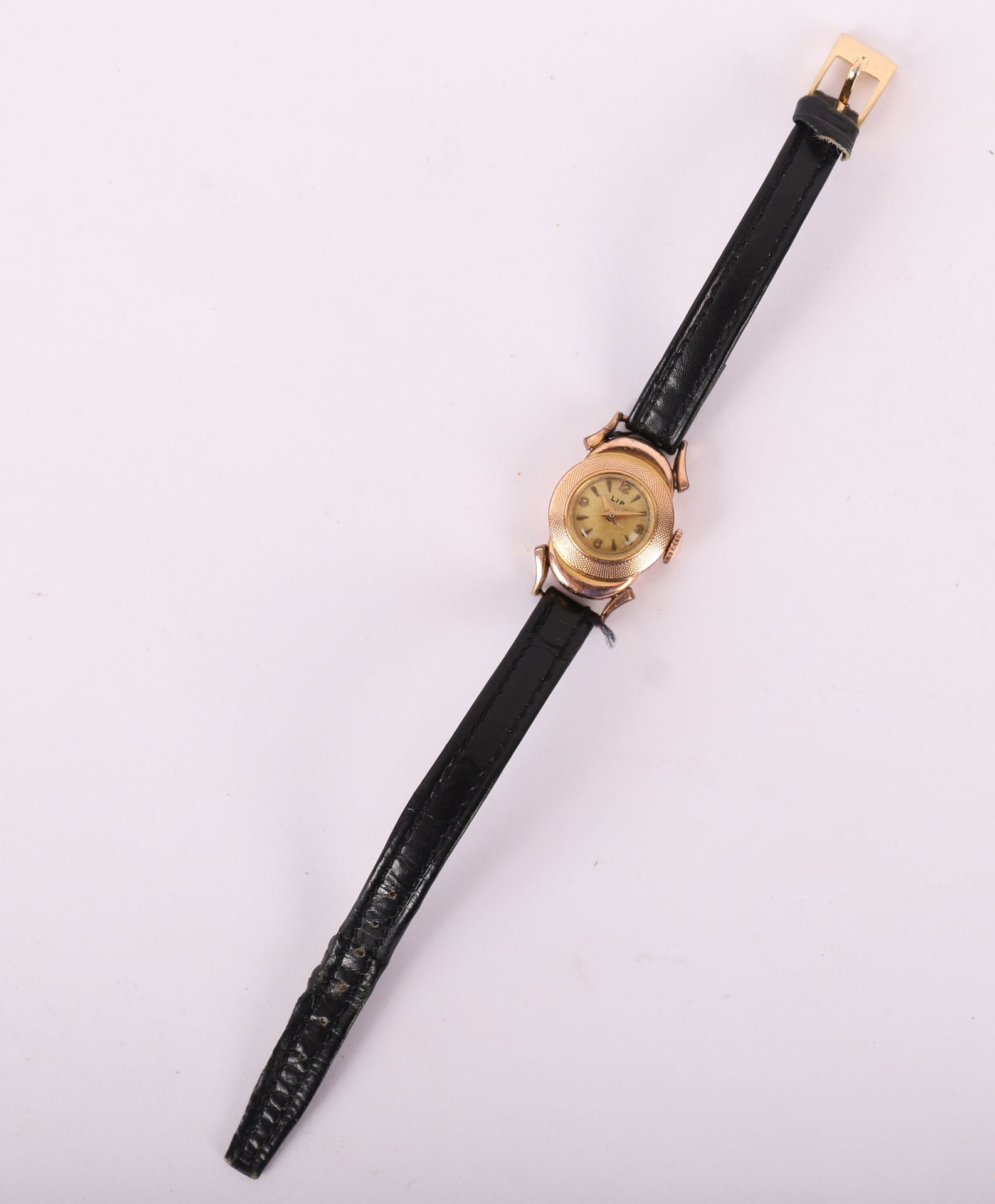 Lip LADY'S WATCH LIP IN GOLD PLATED
Black leather strap
Worn
