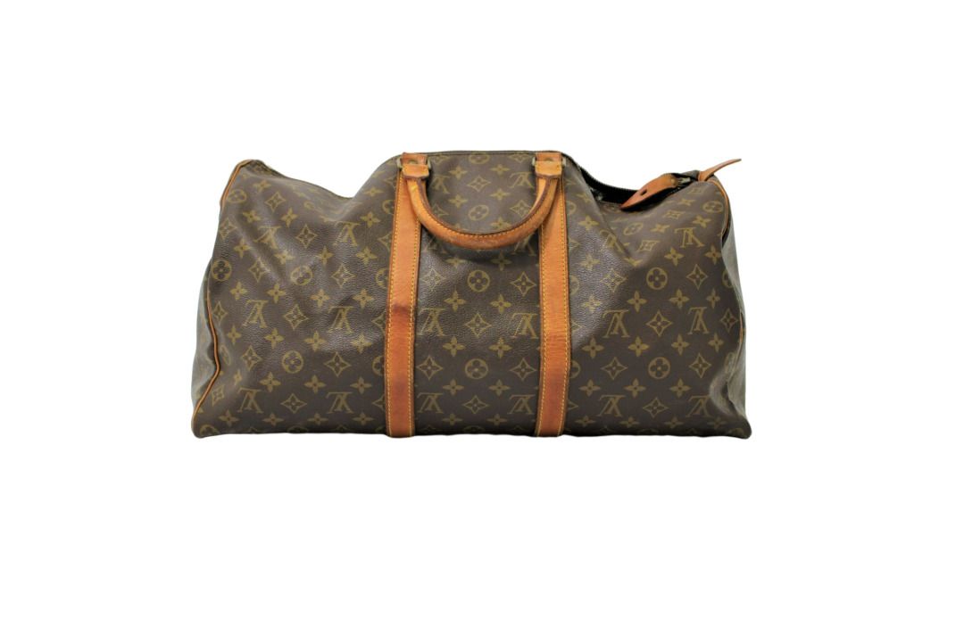 LOUIS VUITTON. Keepall 50 bag in monogrammed canvas and …