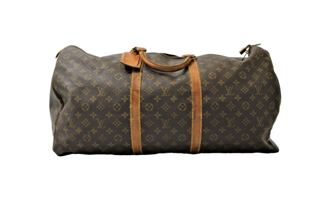 LOUIS VUITTON. Keepall 60 bag in monogram canvas and nat…