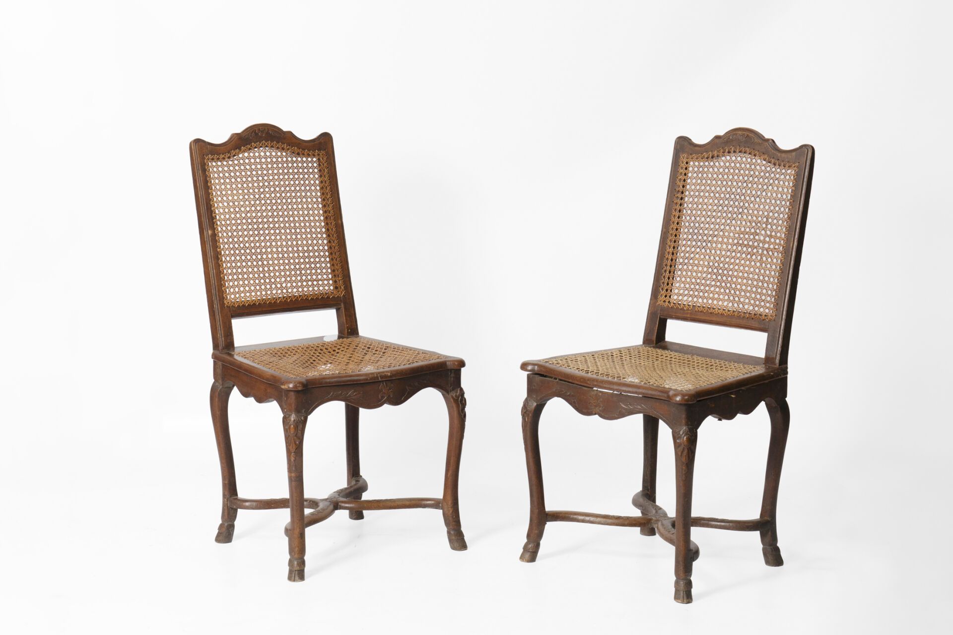 Null Pair of caned chairs with flat backs, molded wood with floral decor, legs w&hellip;