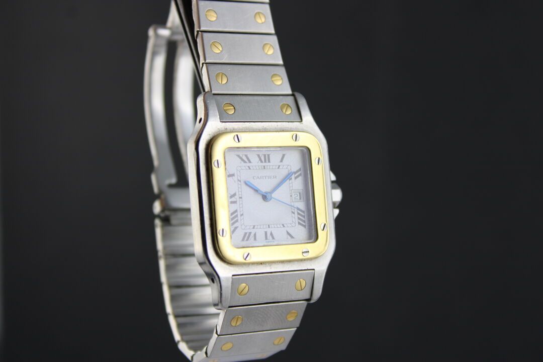 Null CARTIER Santos 
Gold and steel bracelet watch. Square case with screwed bez&hellip;