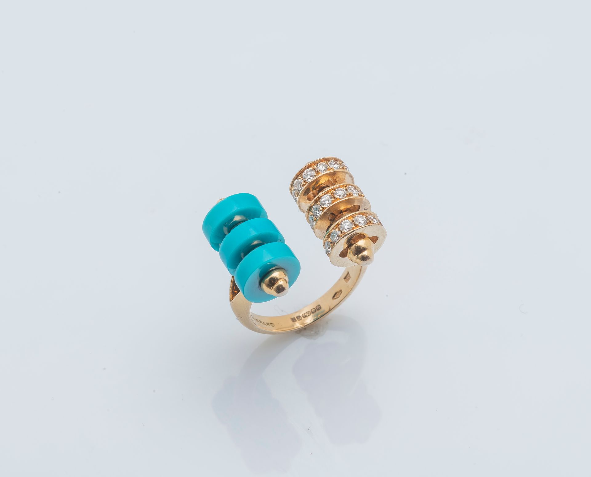 GARRARD An 18k yellow gold (750 ‰) spool ring, the open band terminating in two &hellip;