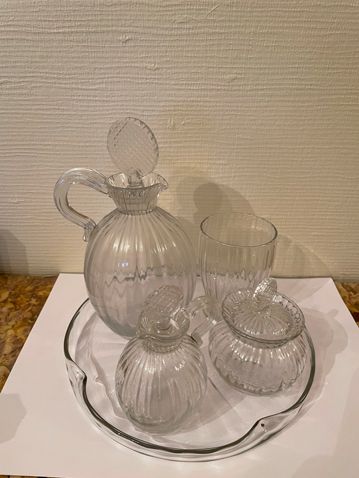 Null Lot including a water glass, two bottles, a sugar bowl, a tray
