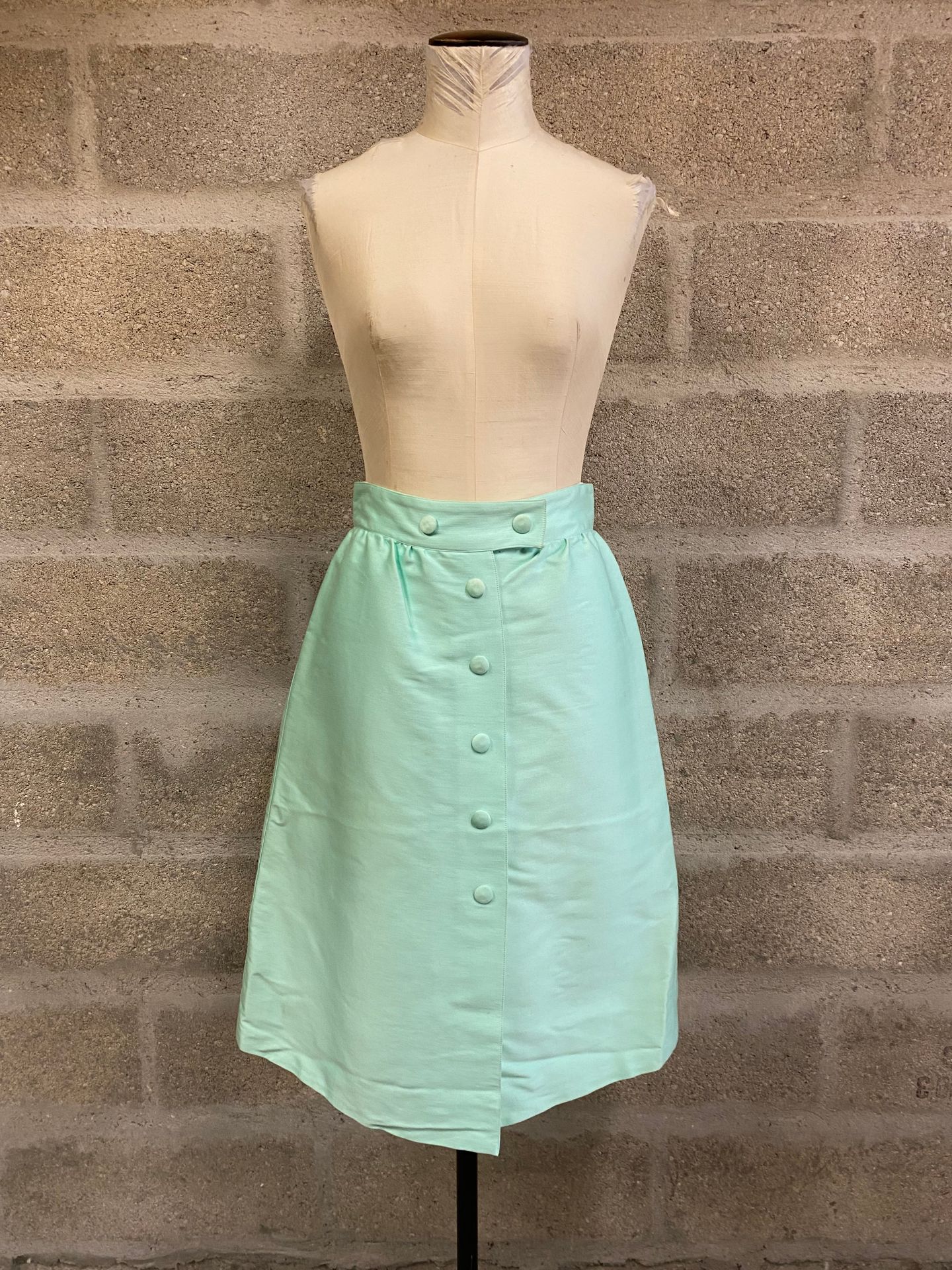 Null Lot including : 

- COURREGES, slightly flared skirt in green satin cotton,&hellip;