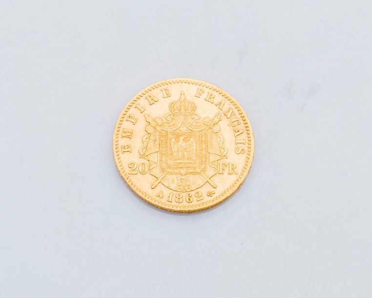 Null Une pièce de 20 francs or Napoléon III, tête laurée, 1862.

Poids : 6,4 g