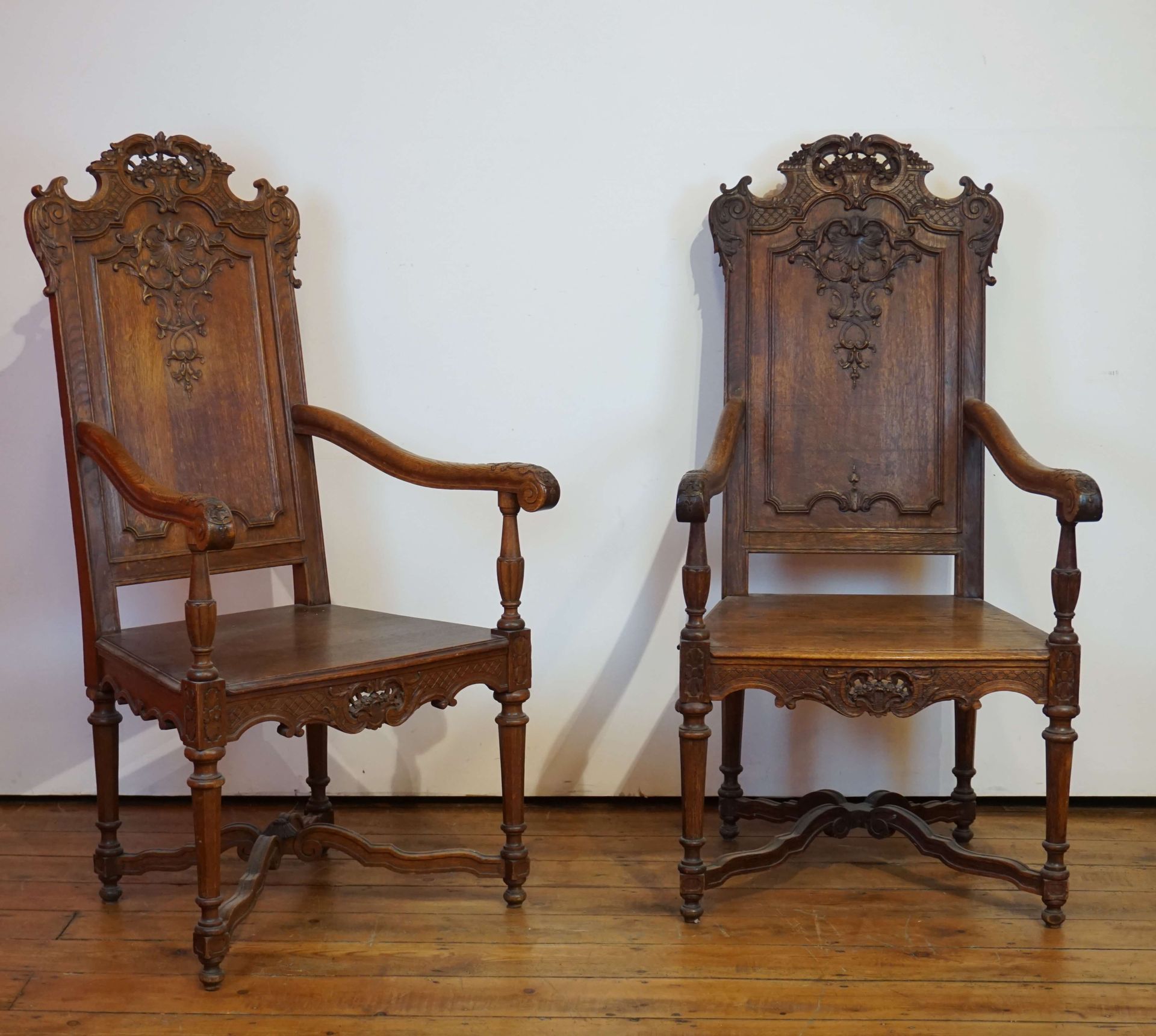Null 2 Liège style armchairs in carved oak