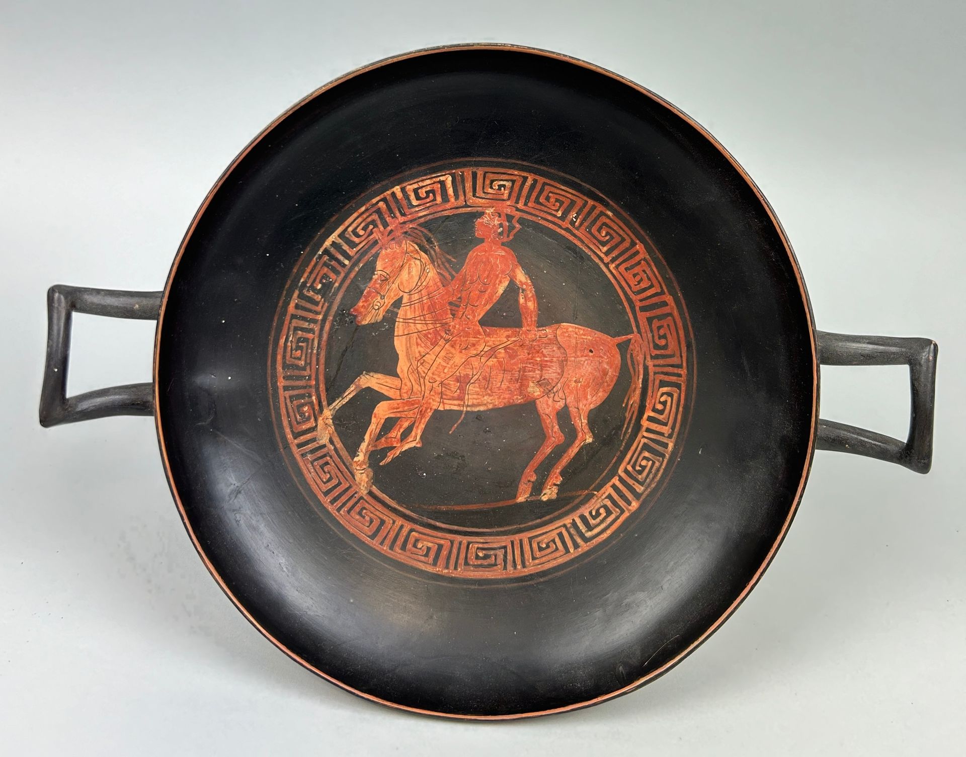 Null AN APULIAN POTTERY KYLIX DECORATED WITH A HORSE AND RIDER CIRCA 5TH CENTURY&hellip;