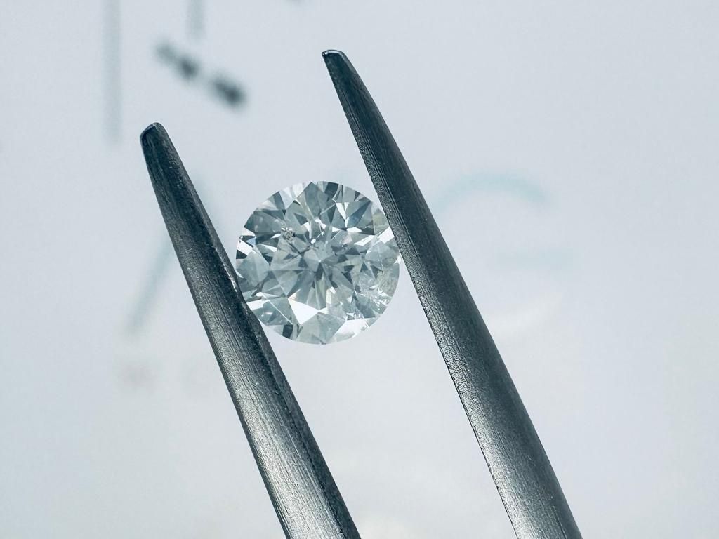 Null 1颗i3钻石0.56克拉H - si3 - 明亮式切割 - AIG证书+激光雕刻 - C30220-9