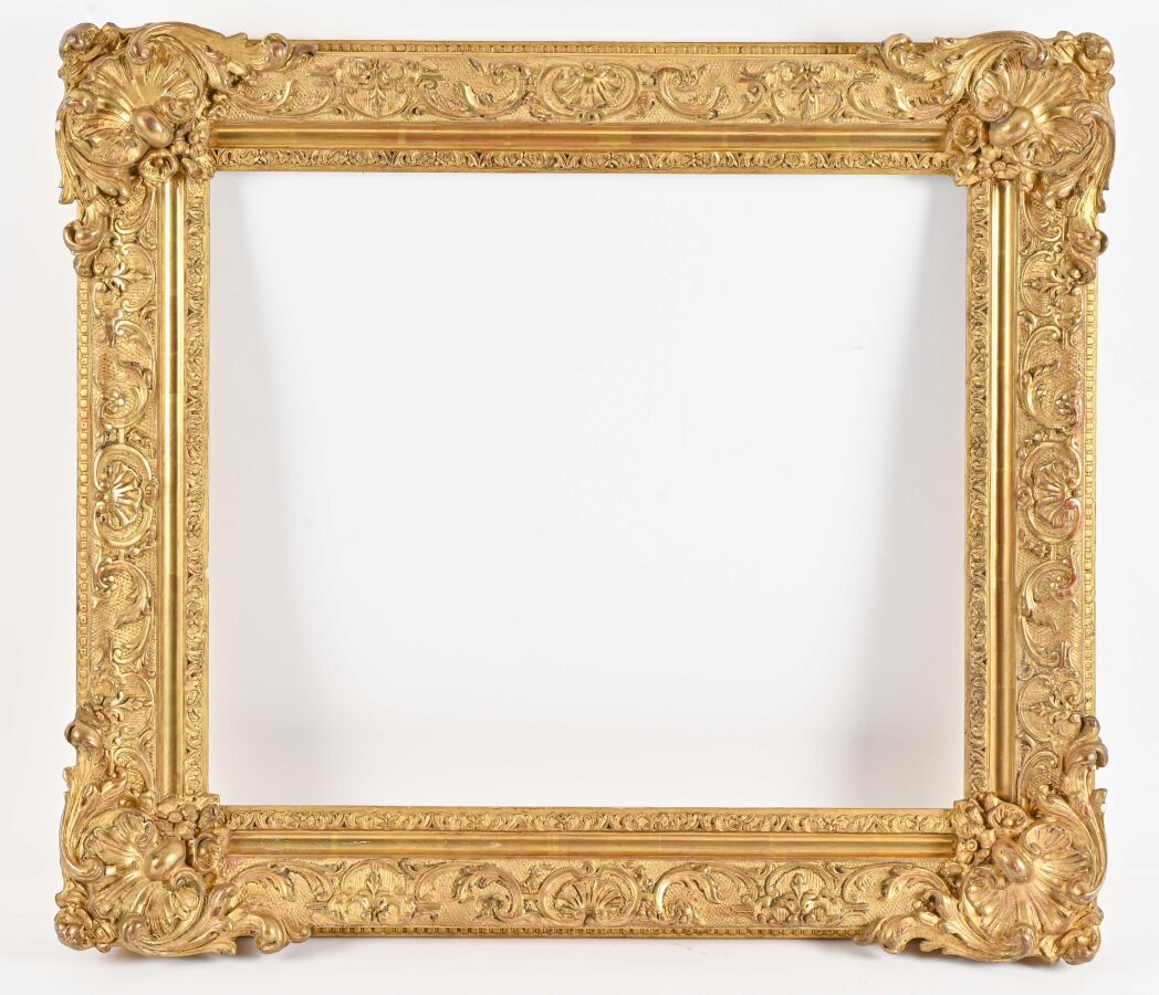 Null Rectangular wood and gilded stucco frame decorated with shells and fleurons&hellip;