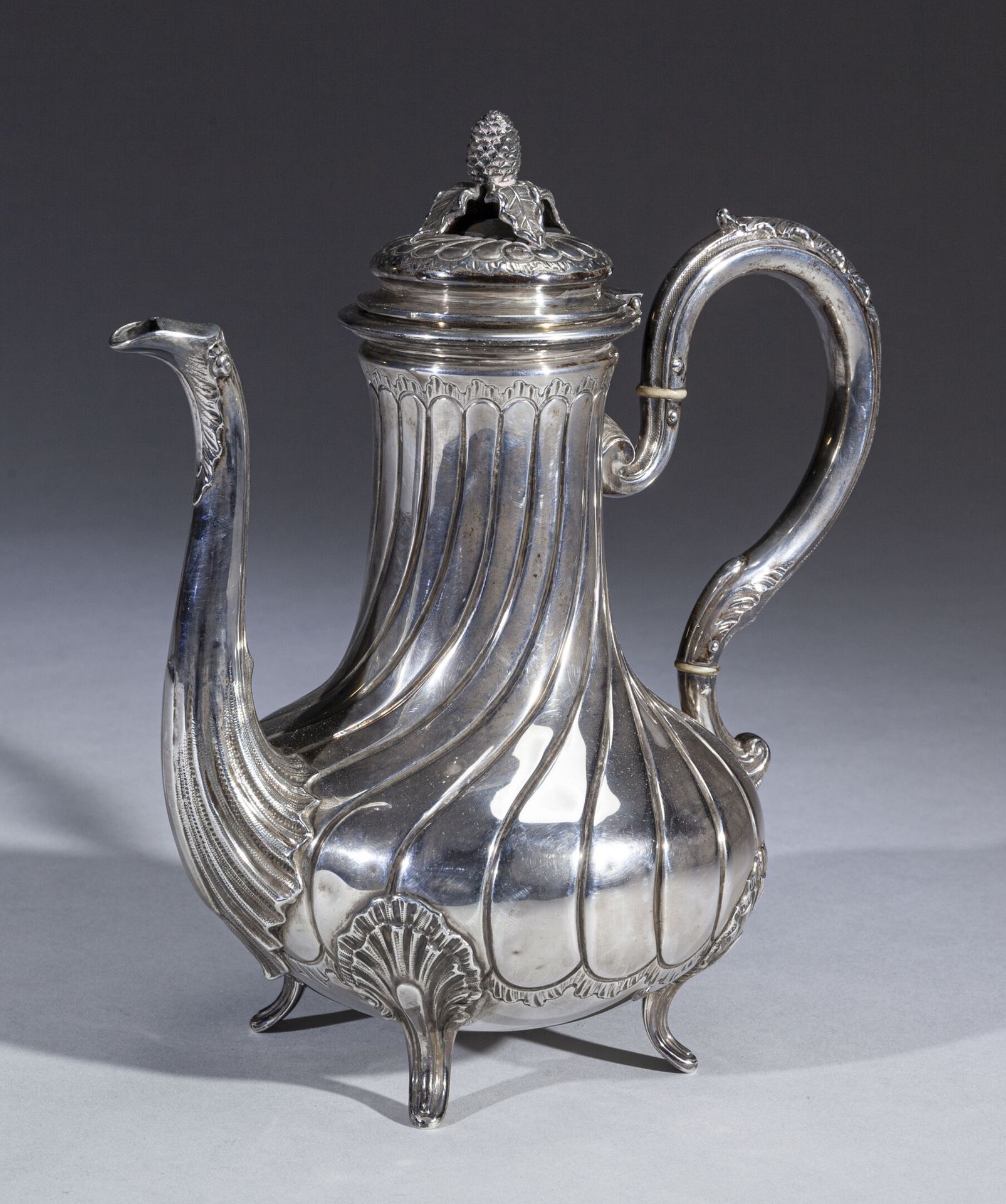 Null A silver baluster-shaped coffee pot decorated with ribs and waves, shells o&hellip;