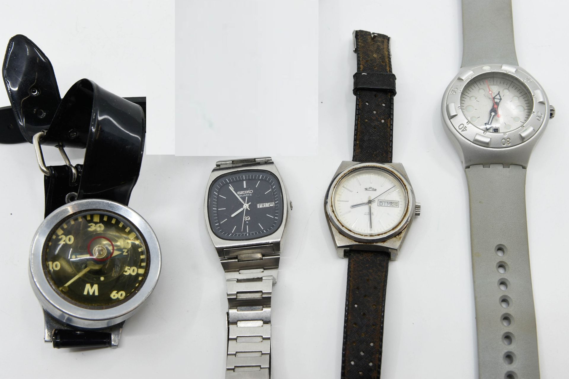 Null Lot comprenant quatre montres de loisir dont : SEIKO, SWATCH, GIROR, YCM 
U&hellip;