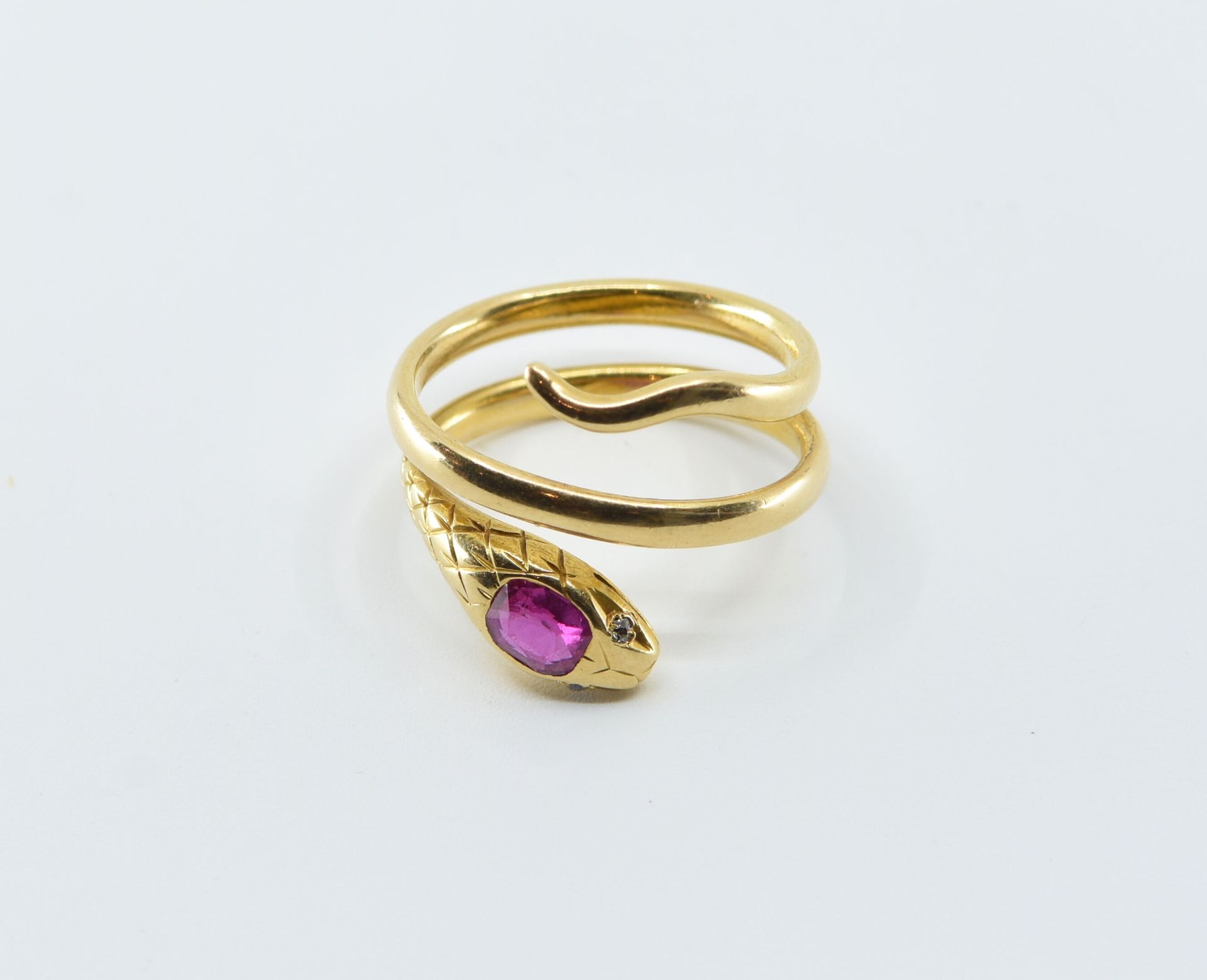 Null Snake ring in 18K yellow gold (750°/°°) set with a ruby on the top of the h&hellip;