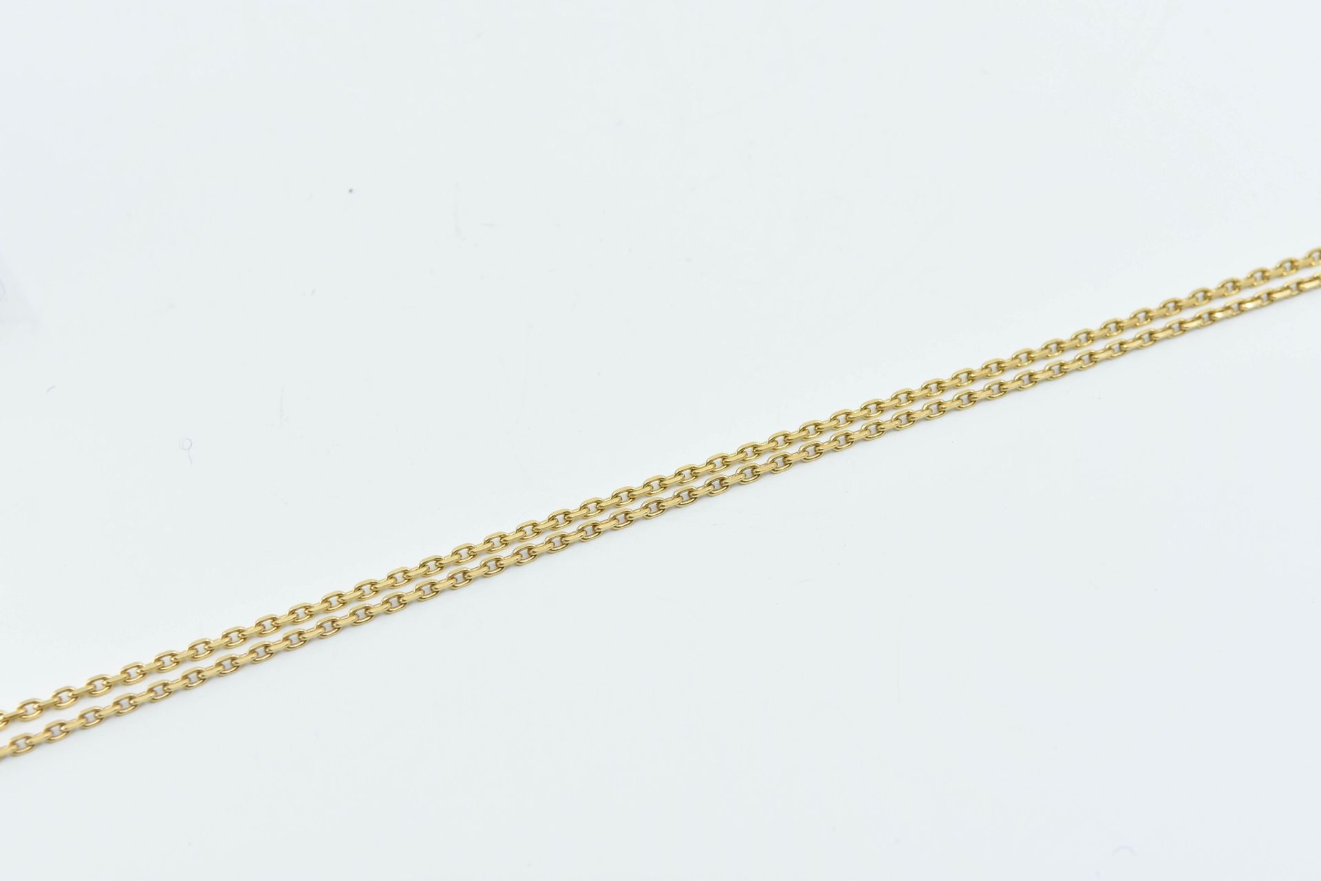 Null 由两条18K(750°/°)黄金链组成的forçat缝线
总重量：18.1克 - 长45厘米和60厘米