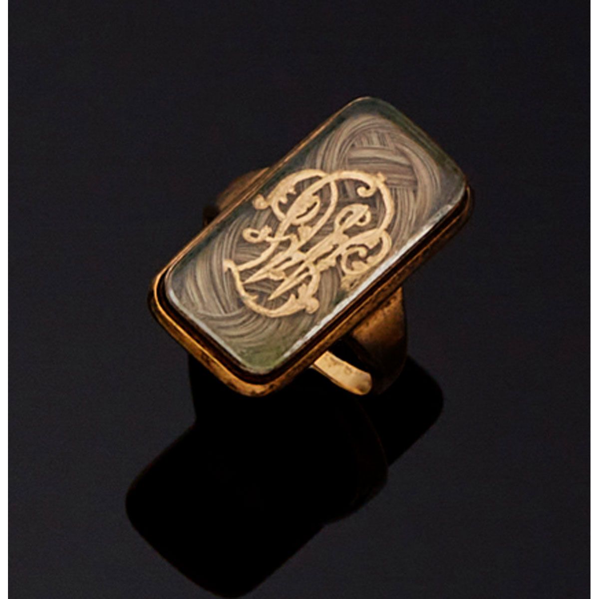 Null 9K 385毫米金的长方形榄尖形戒指，装饰有发辫，上面有一个数字。旧作。 

B.P. 6,6g。- TDD 54