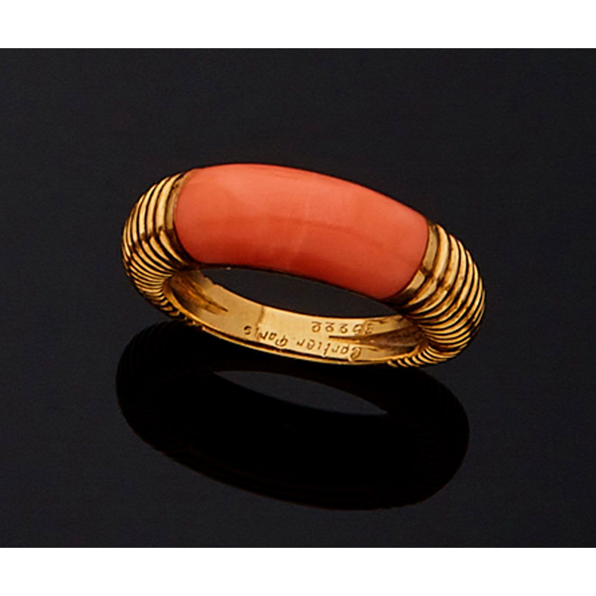 Null CARTIER. 

18K yellow gold and coral fluted ring, French work, hallmark of &hellip;