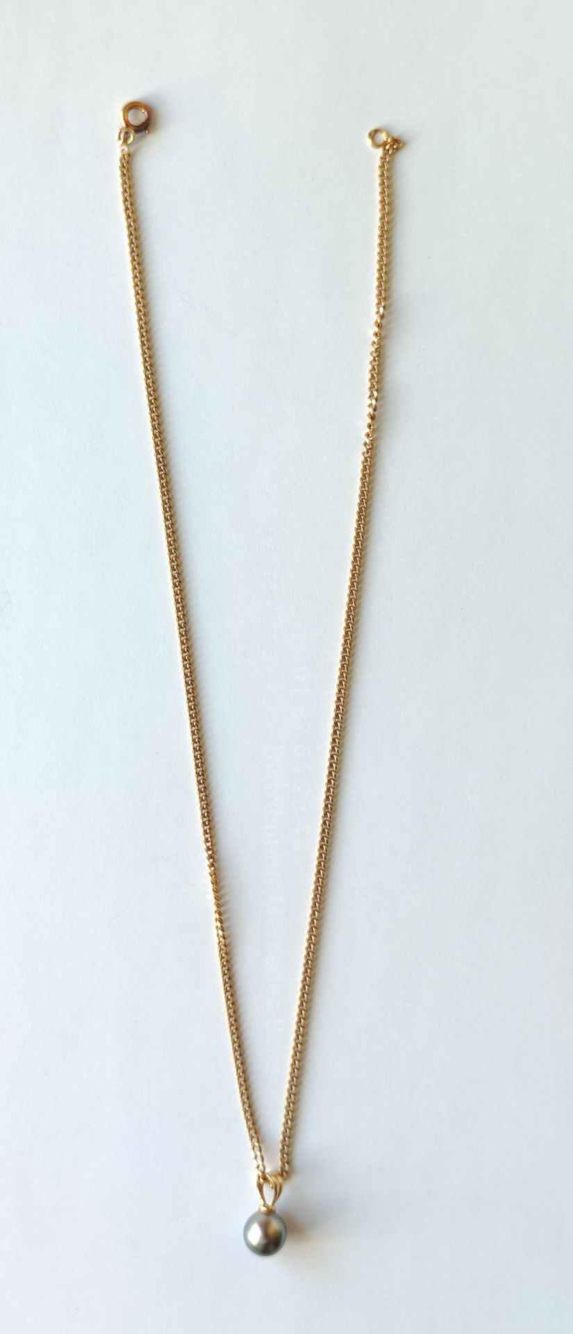 Null 
Chain in yellow gold 750°/°°.
Length : 41cm Weight : 6.7 grams
with Pendan&hellip;