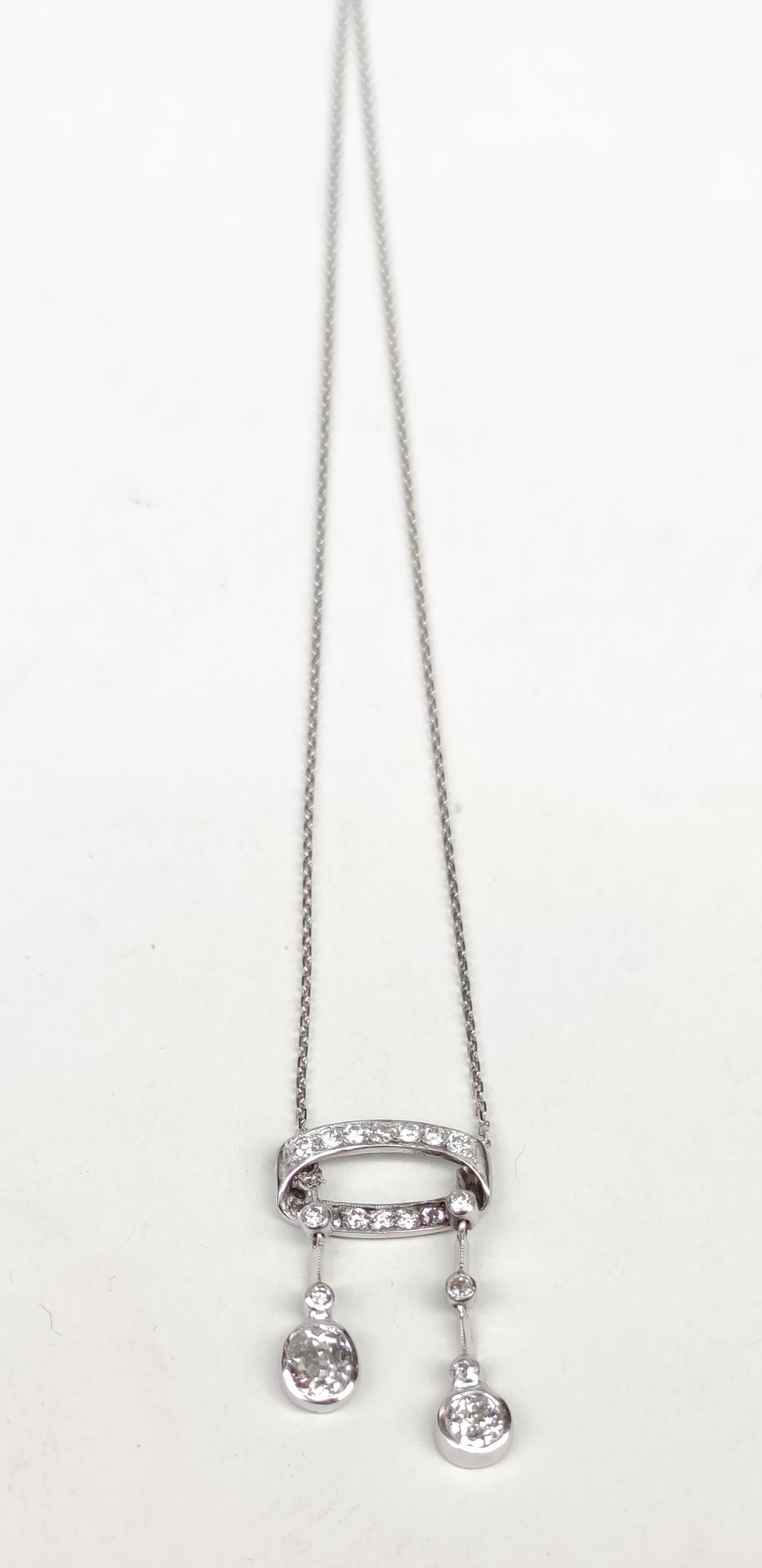 Null 
A pendant in white gold 750°/00 set with two old-cut diamonds,

One approx&hellip;