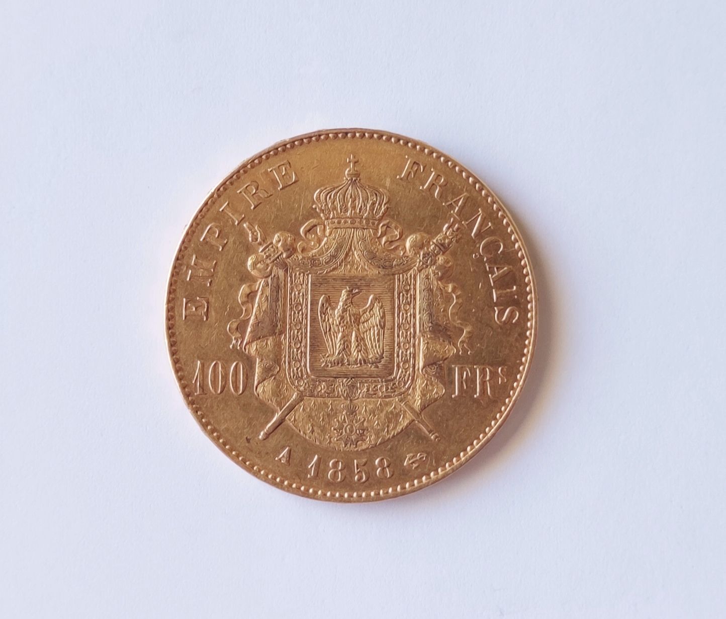 Null 
拿破仑三世100法郎黄金片，光头，A1858重量：32.2克
费用：价格的10%。