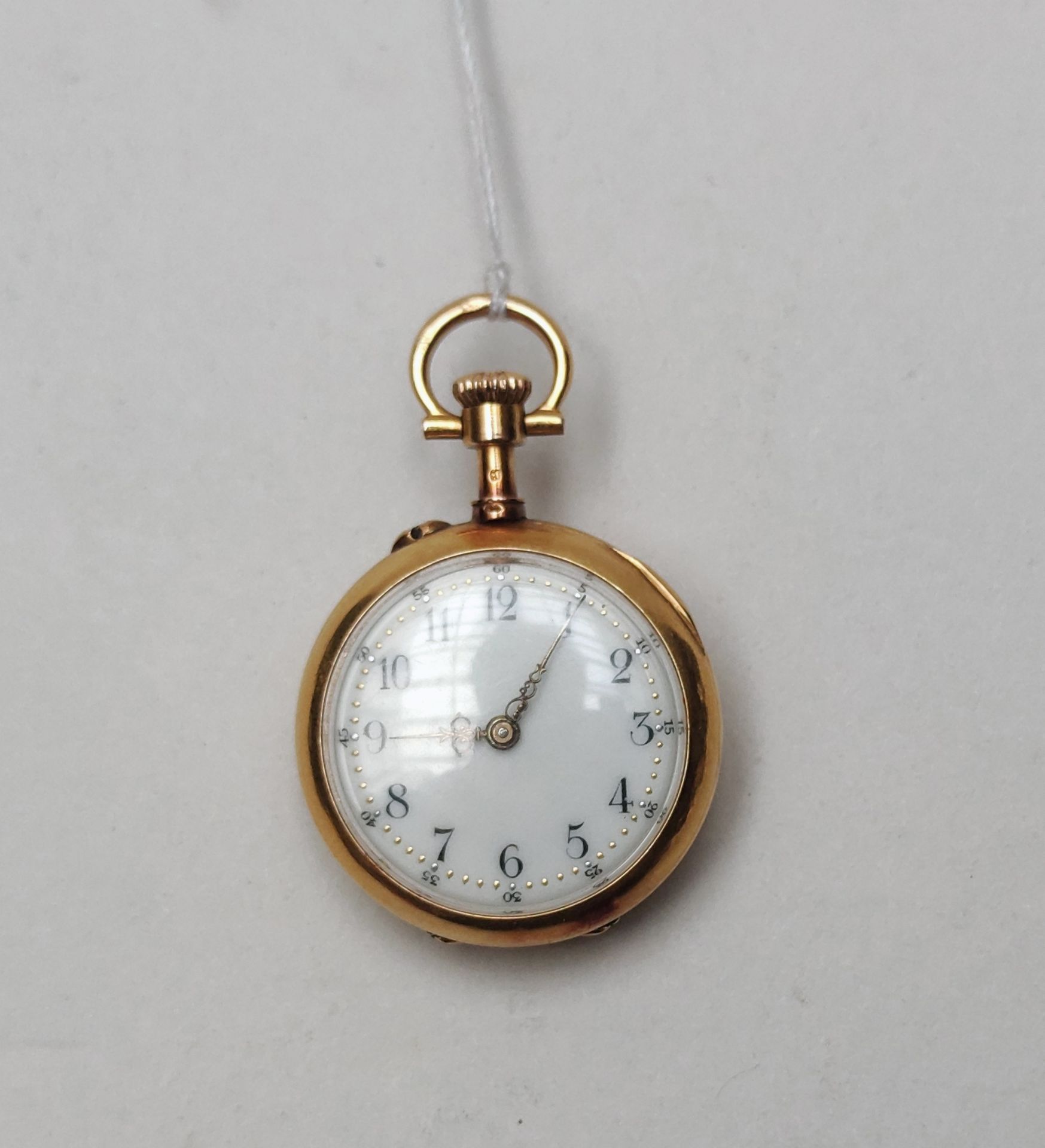 Null Pequeño reloj de bolsillo en oro amarillo 750°/00 

Peso : 18 g
