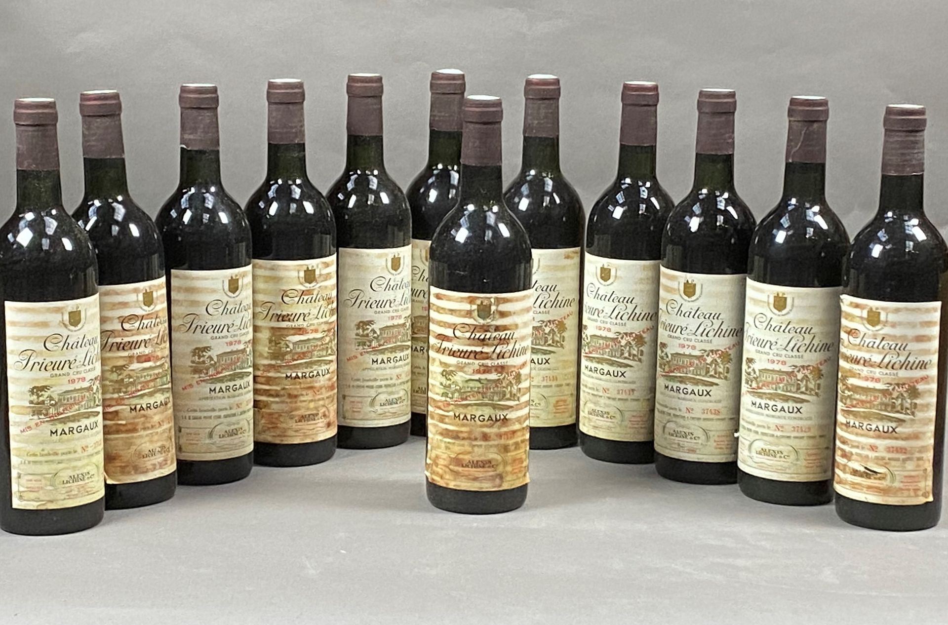 Null 12 bottles Château Prieuré-Lichine 1978 4th GCC Margaux CB (BG, stained lab&hellip;