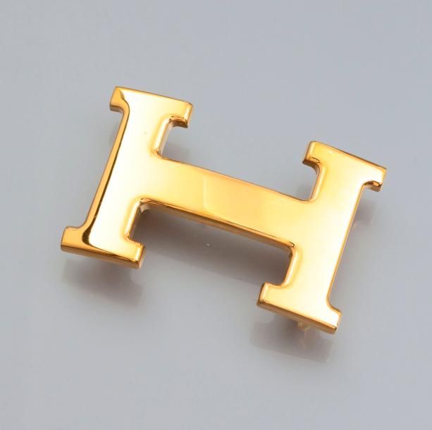 HERMES Boucle Constance en métal doré, pour ceinture 35 mm. Signée, pochette
