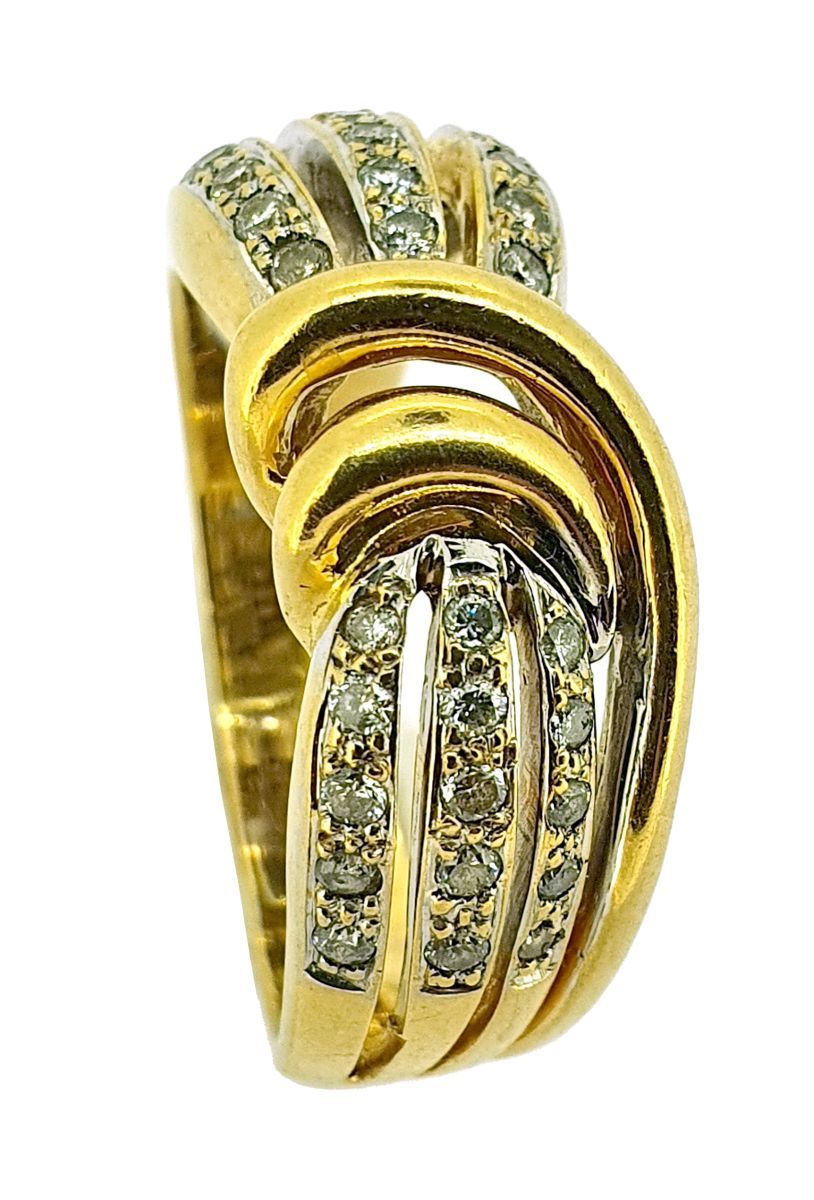 Bague 
以18K（750）黄金制成，呈弓形铺设小钻石。

毛重：8.8克 - 手指尺寸：60