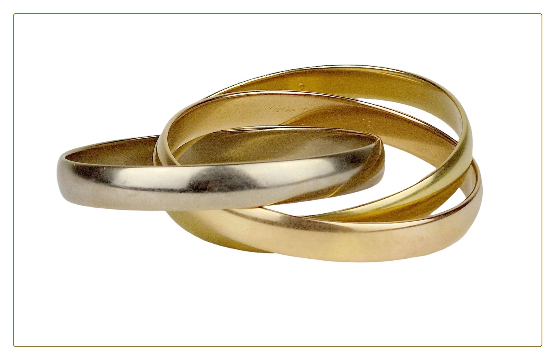 CARTIER Bracelet "Trinity" grand modèle

-Aux trois ors 18k (750), signé et numé&hellip;