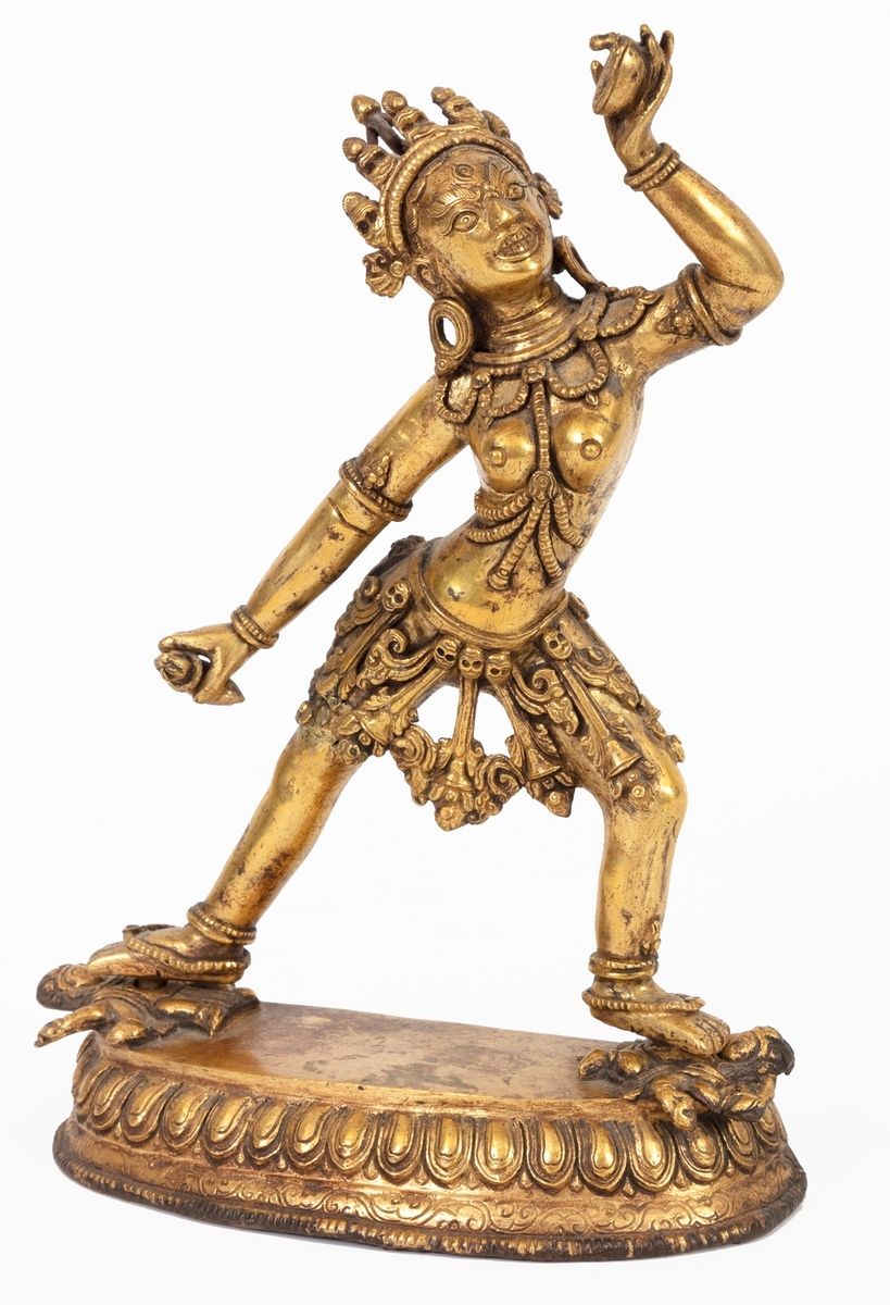 Null 西藏，19世纪末
站立的达基尼镀金青铜雕塑。
封口板上装饰有双金刚。
高度：21厘米