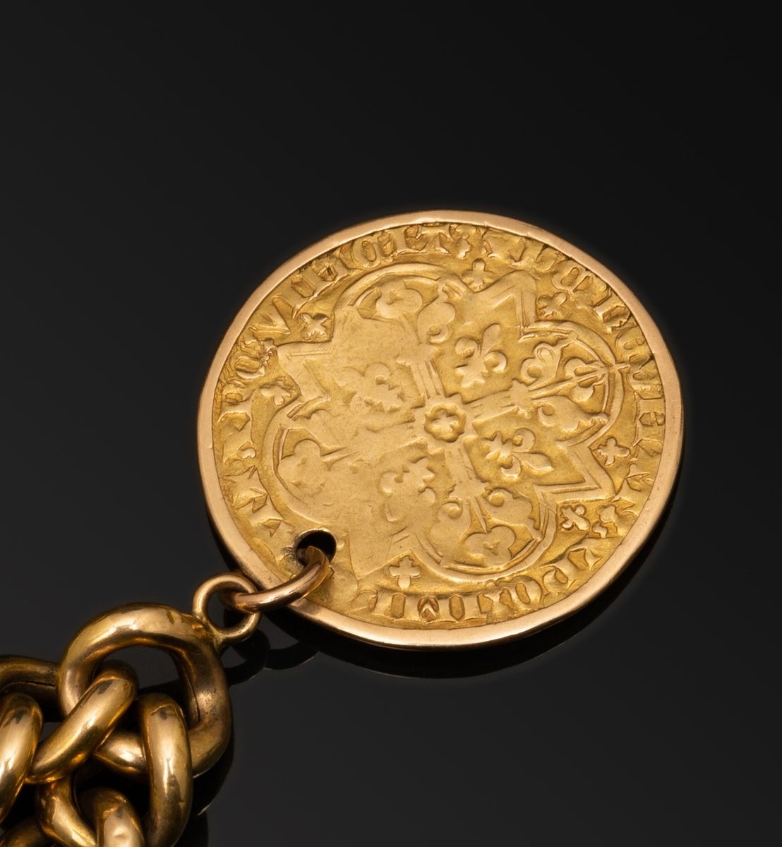Null Bracelet gourmette en or jaune 18k (750 millièmes) retenant un monnaie d'or&hellip;