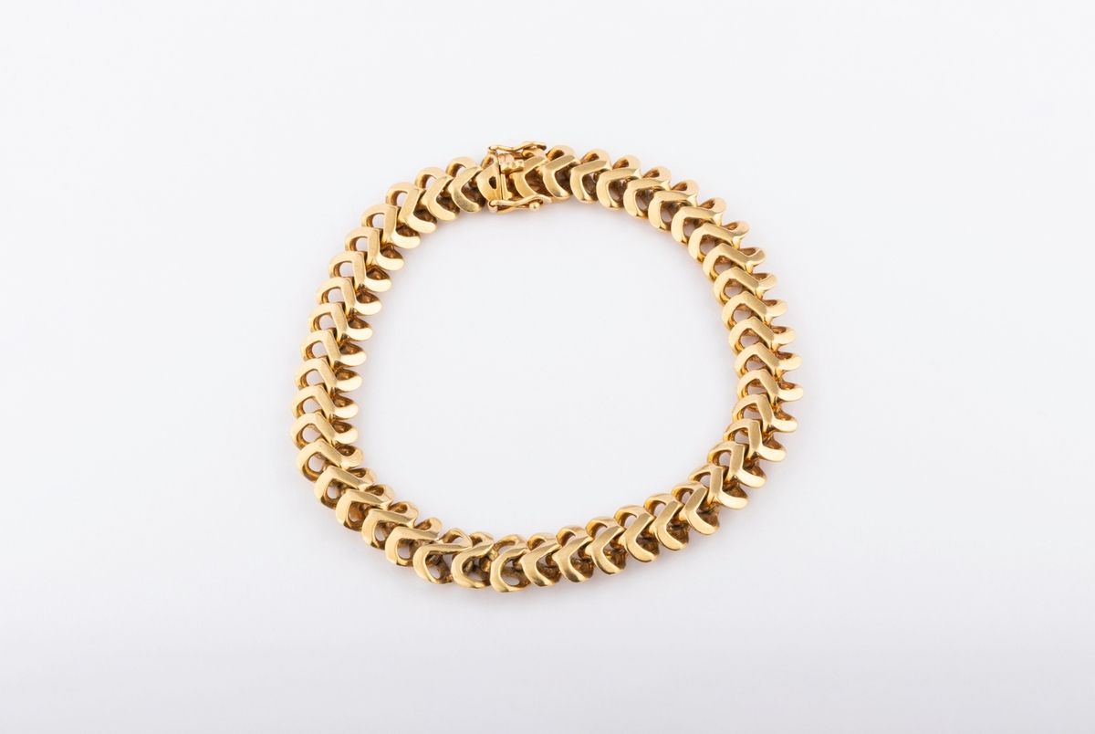 Null 18K黄金（千分之七十五）实心链节的扁蛇形手链。有磨损的痕迹。
长度：20.5厘米。 
毛重：44.2克。
