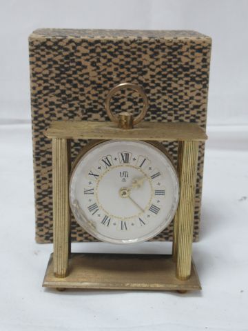 Null UTI Brass clock. 10 cm In a cardboard box.