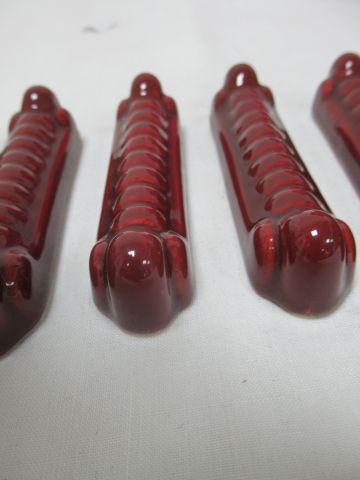 Null In the taste of Sarreguemines, suite of 12 knife holders in red earthenware&hellip;