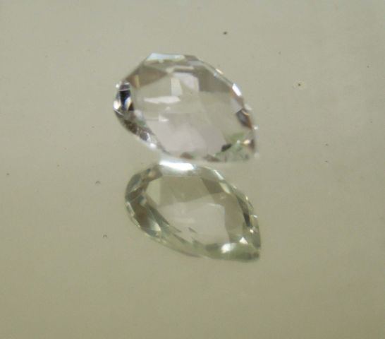 Null 14.18 carat pear quartz on paper.