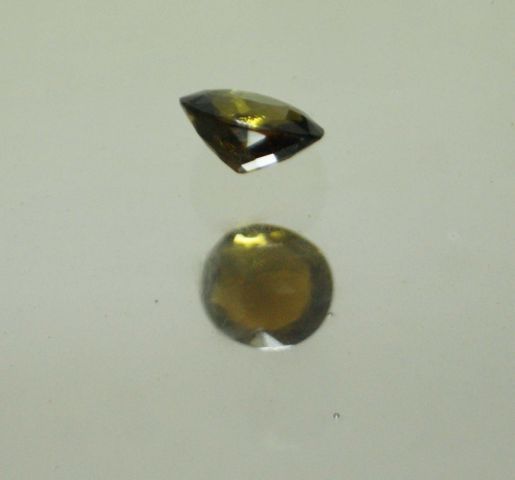 Null Oval tourmaline of 2,24 carats on paper.