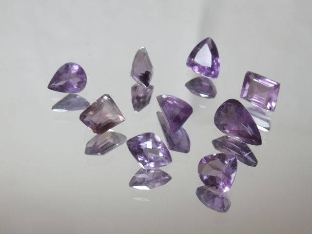 Null Set of 9 amethysts. About 1 cm each.