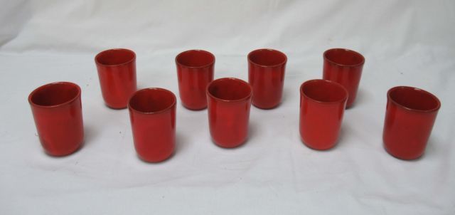 Null Valoris, juego de 9 timbales de cerámica roja, h : 9 cm.