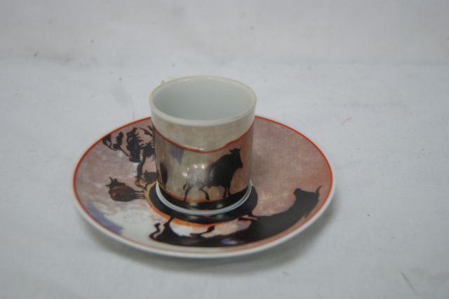 Null Porcelain cup and saucer with bullfighting decoration.