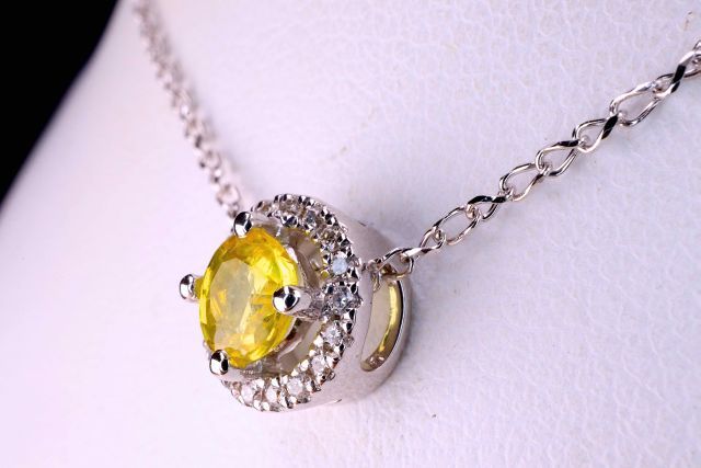 Null Necklace in 18 kt white gold set with a natural yellow sapphire, round bril&hellip;
