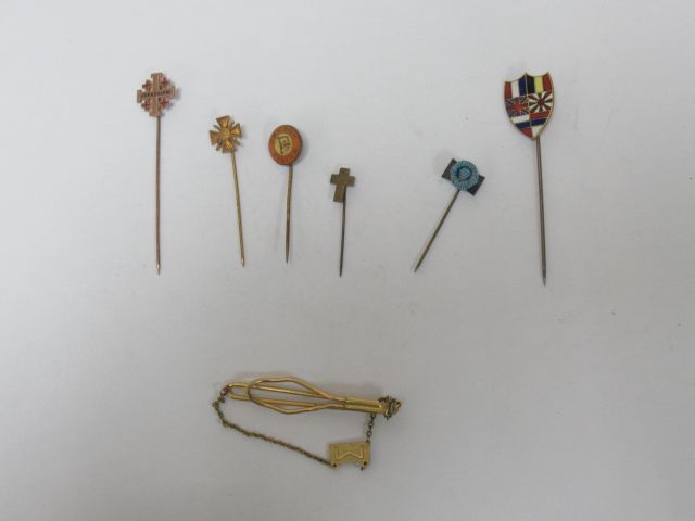 Null Set of 6 gilt and enamelled metal pins. A hair clip is attached.