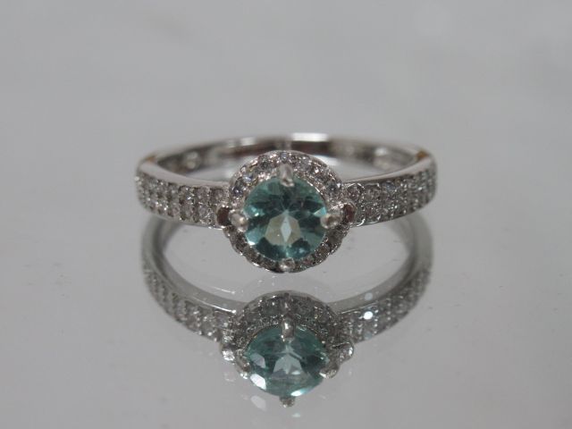 Null Ring in silver 925/1000e set with a brilliant cut apatite surrounded by a m&hellip;