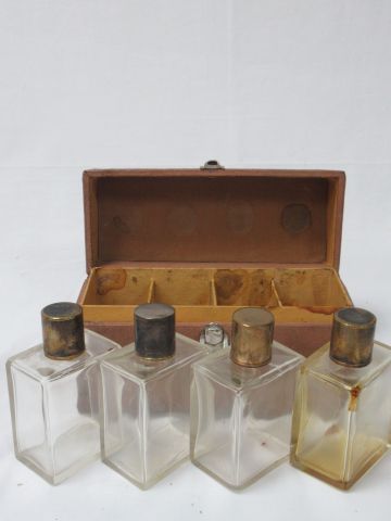 Null Suite of 4 crystal bottles. Silver and gold metal stoppers. 11 cm. In their&hellip;
