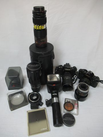 Null CANON Lot including a F-1 camera, an A-1 camera, a Lens FD 135 mm 1: 3.5, W&hellip;